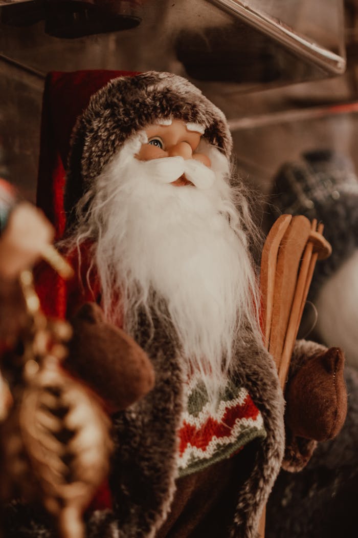 Close-up of a festive Santa Claus doll with skis, perfect for Christmas decorations.